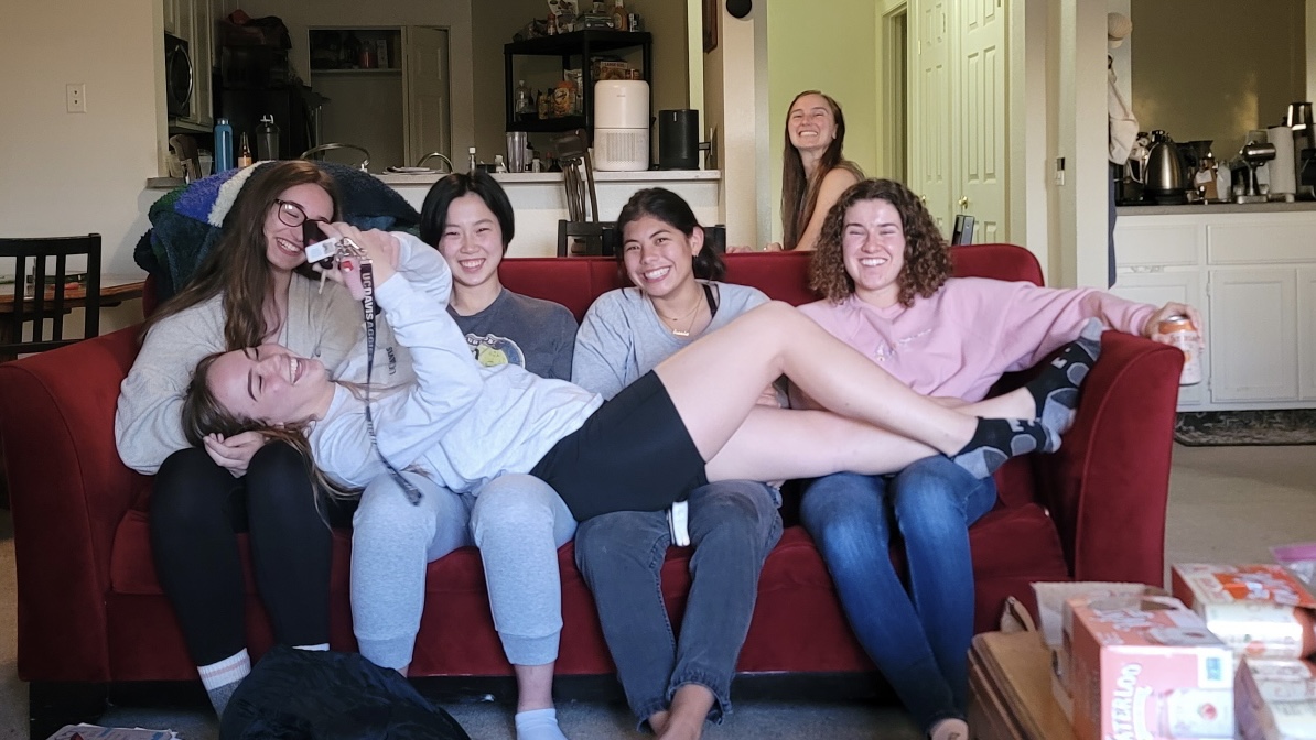 college students gathered together on one couch during a christian bible study fellowship